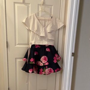 White top and flowered skirt